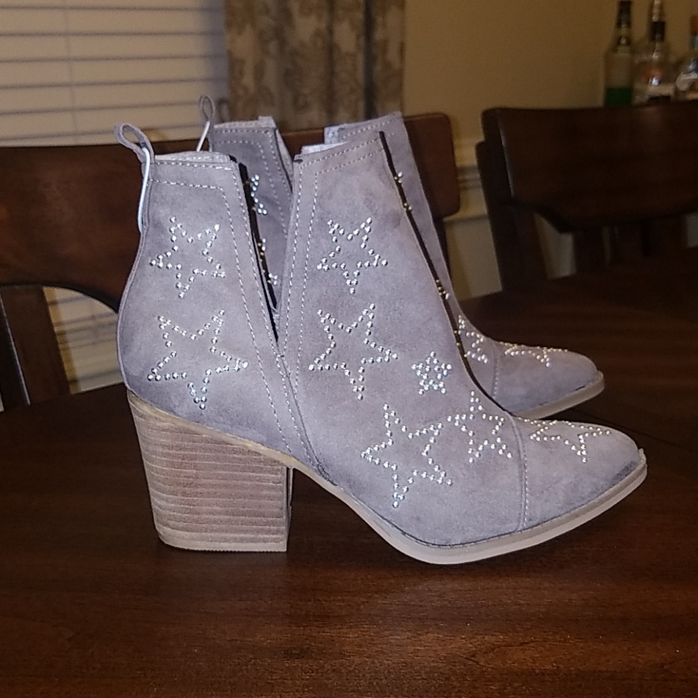 Star studded booties by Carlos Santana